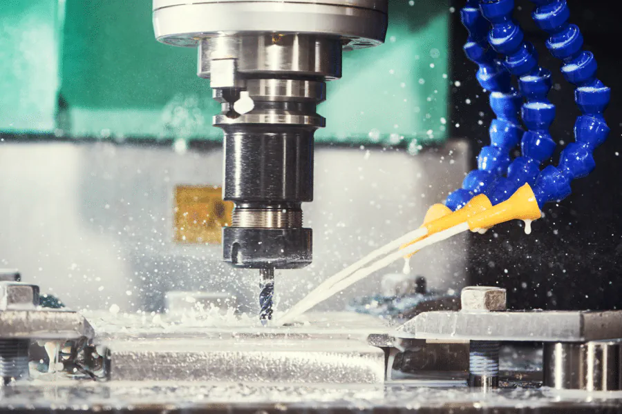 A CNC milling tool machining a metal workpiece